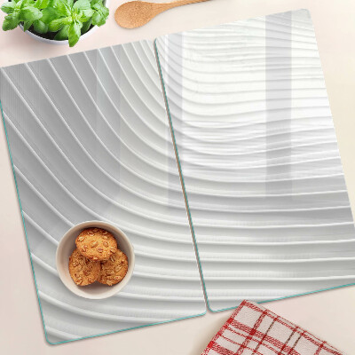 Tabla de cortar de cristal Ondas y líneas en tonos de gris.