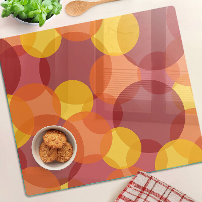 Tabla para cortar Círculos coloridos en tonos cálidos.