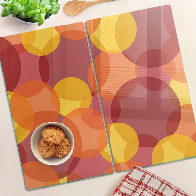 Tabla para cortar Círculos coloridos en tonos cálidos.