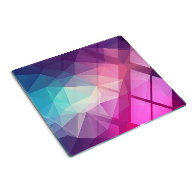 Tabla de cortar de cristal Geometría en tonos rosa y azul.
