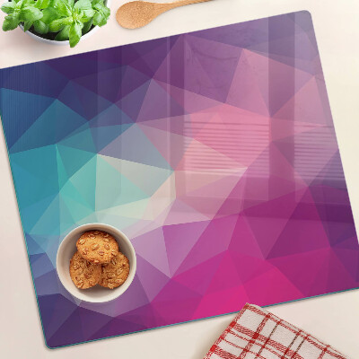 Tabla de cortar de cristal Geometría en tonos rosa y azul.