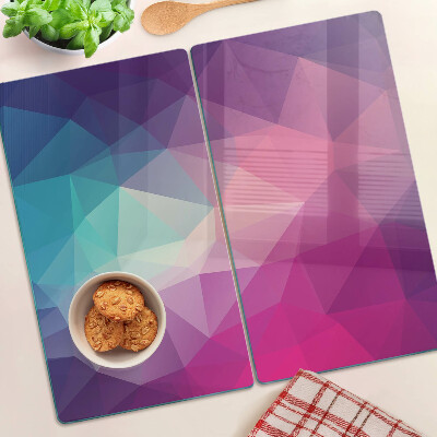 Tabla de cortar de cristal Geometría en tonos rosa y azul.