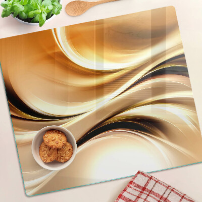 Tabla de cortar de cristal Ondas abstractas en tonos dorados