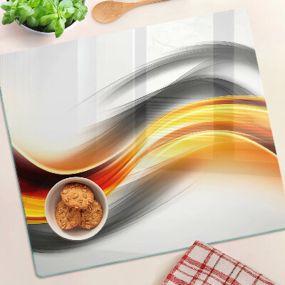Tabla de cortar de cristal Ondas en naranja y negro