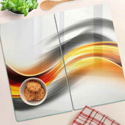 Tabla de cortar de cristal Ondas en naranja y negro