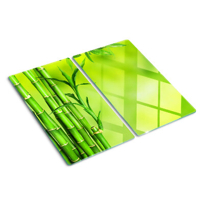 Tabla de cortar de cristal Bambú sobre un fondo verde