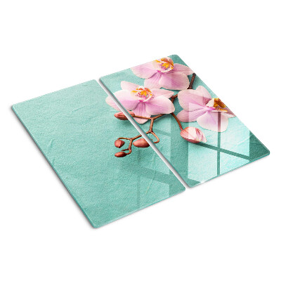 Tabla para cortar Orquídeas sobre fondo azul