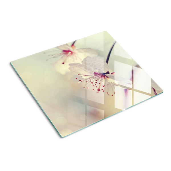 Tabla para cortar Flores sobre un fondo geométrico