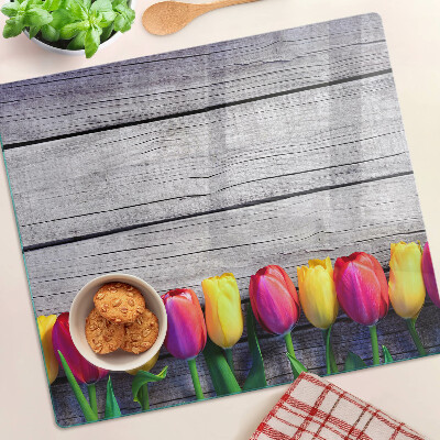 Tabla de cortar de cristal Tulipanes sobre un fondo de madera