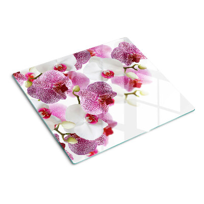 Tabla de cortar de cristal Orquídeas frente a la ventana