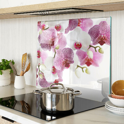 Tabla de cortar de cristal Orquídeas frente a la ventana