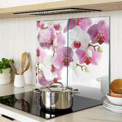 Tabla de cortar de cristal Orquídeas frente a la ventana