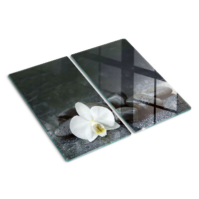 Tabla para cortar Flor de orquídea sobre piedras