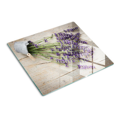 Tabla de cortar de cristal Lavanda en una maceta sobre un fondo de madera