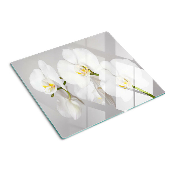 Tabla de cortar de cristal Orquídeas sobre un fondo de espejo