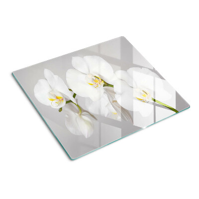 Tabla de cortar de cristal Orquídeas sobre un fondo de espejo