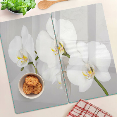 Tabla de cortar de cristal Orquídeas sobre un fondo de espejo