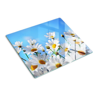 Tabla para cortar Flores de margarita sobre un fondo azul