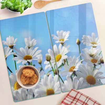 Tabla para cortar Flores de margarita sobre un fondo azul