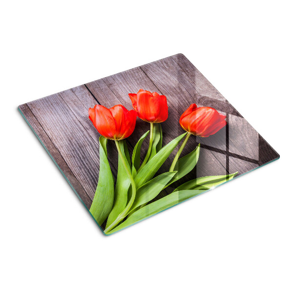 Tabla de cortar de cristal Tulipanes sobre un fondo de madera