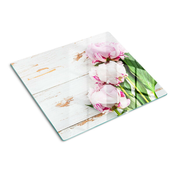Tabla para cortar Flores de peonía sobre un fondo de madera