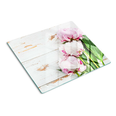 Tabla para cortar Flores de peonía sobre un fondo de madera