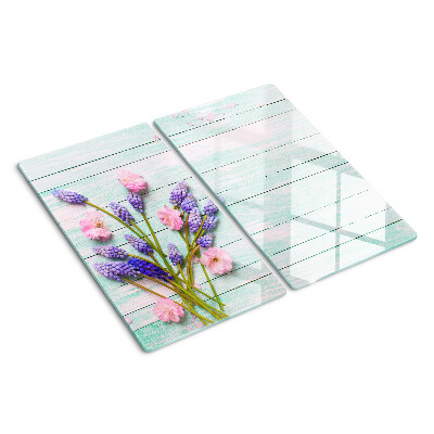 Tabla de cortar de cristal Flores sobre un fondo de madera