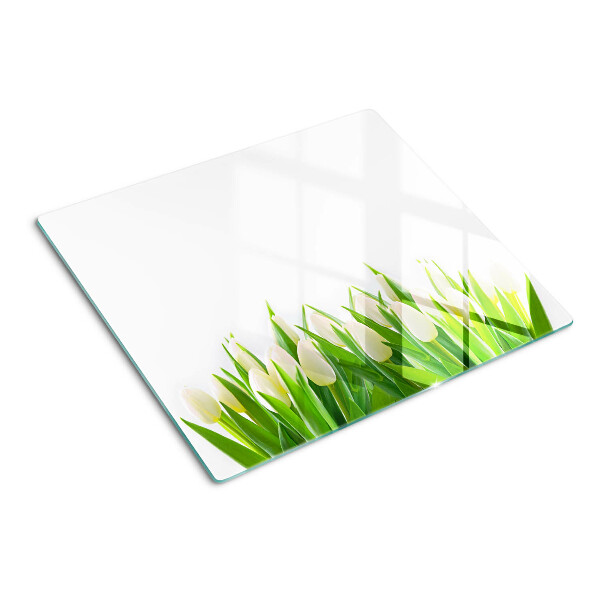 Tabla de cortar de cristal Tulipanes en la hierba verde