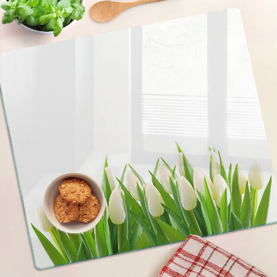 Tabla de cortar de cristal Tulipanes en la hierba verde