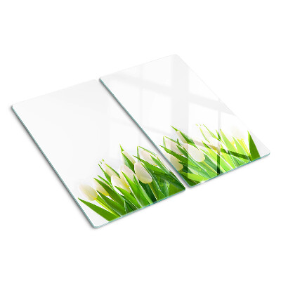 Tabla de cortar de cristal Tulipanes en la hierba verde