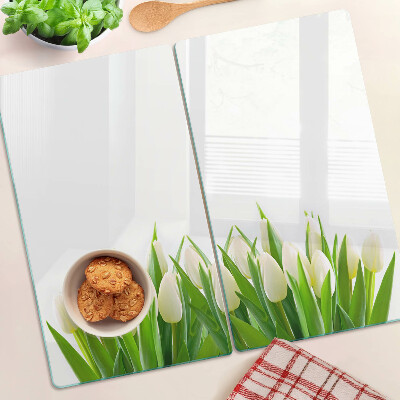 Tabla de cortar de cristal Tulipanes en la hierba verde