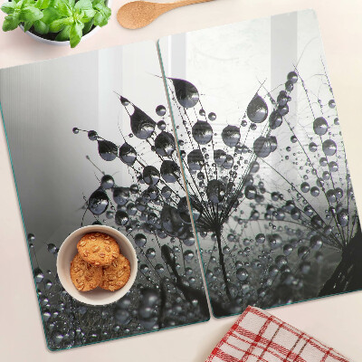 Tabla de cortar de cristal Gotas de agua sobre las plantas