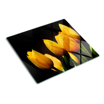 Tabla para cortar Tulipanes amarillos sobre fondo negro