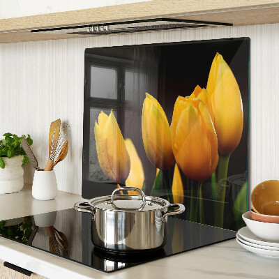 Tabla para cortar Tulipanes amarillos sobre fondo negro