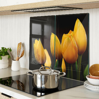 Tabla para cortar Tulipanes amarillos sobre fondo negro