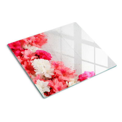 Tabla de cortar de cristal Flores en tonos rosa y blanco.