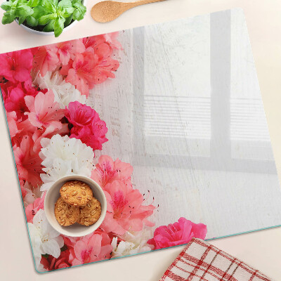 Tabla de cortar de cristal Flores en tonos rosa y blanco.
