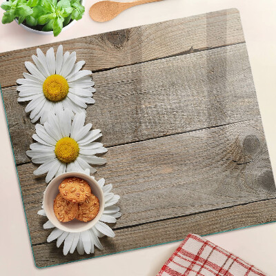Tabla de cortar de cristal Flores sobre un fondo de madera