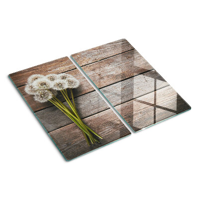Tabla para cortar Flores de diente de león sobre un fondo de madera