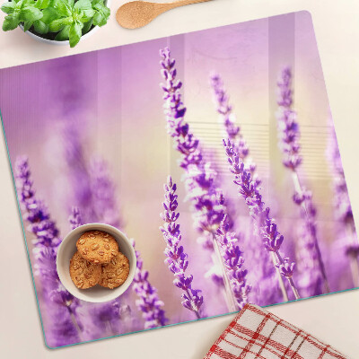 Tabla de cortar de cristal Flores de lavanda sobre un fondo degradado.