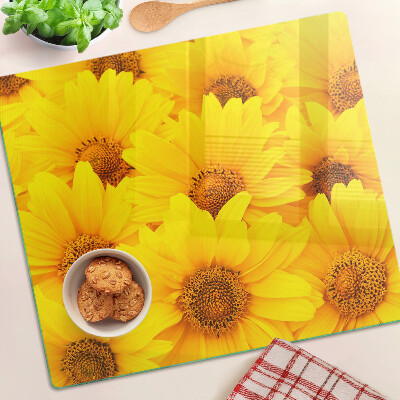 Tabla de cortar de cristal Girasoles sobre un fondo amarillo