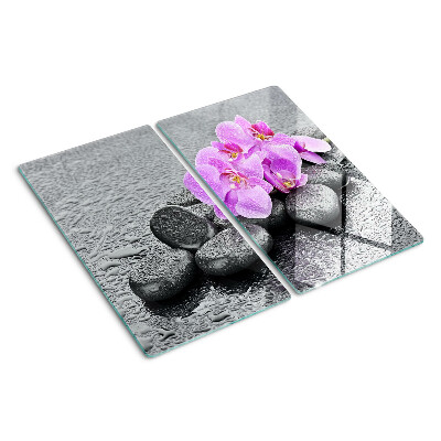 Tabla de cortar de cristal Flores y piedras contra el agua.