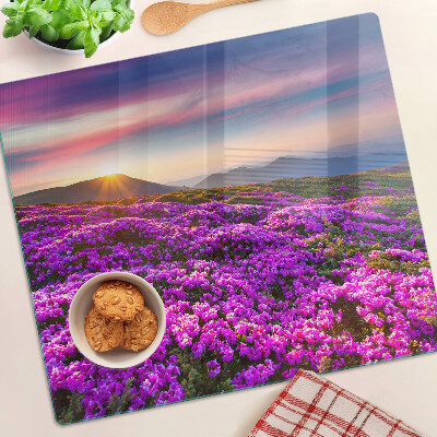 Tabla de cortar de cristal Paisaje de flores al atardecer