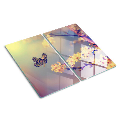 Tabla de cortar de cristal Motivo de mariposa sobre un fondo de flores.