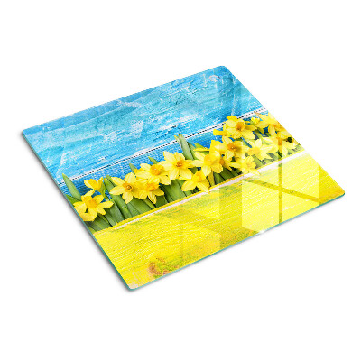 Tabla para cortar Flores de narciso contra el cielo