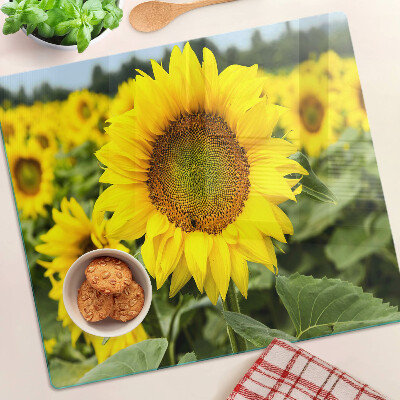 Tabla de cortar de cristal Girasoles sobre un fondo verde