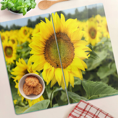 Tabla de cortar de cristal Girasoles sobre un fondo verde
