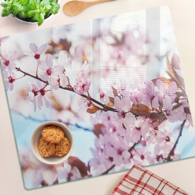 Tabla para cortar Flores de cerezo sobre un fondo azul
