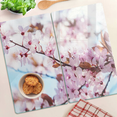 Tabla para cortar Flores de cerezo sobre un fondo azul