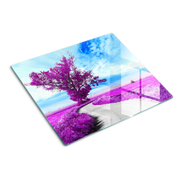 Tabla para cortar Árbol morado contra el cielo